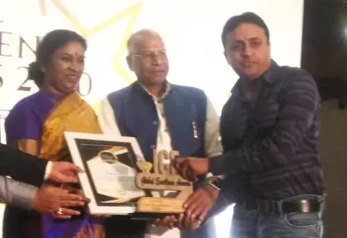 Dileep receiving Global Excelancy Award from Mrs.K. Pushpaleela (Ex Minister Andhra Pradesh)
