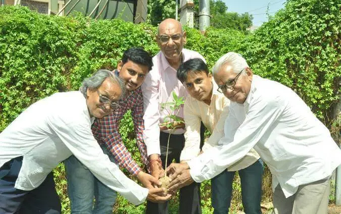Image of Permanand Kessani along with Dileep Kessani and other social worker for Planting drive on Environment Day